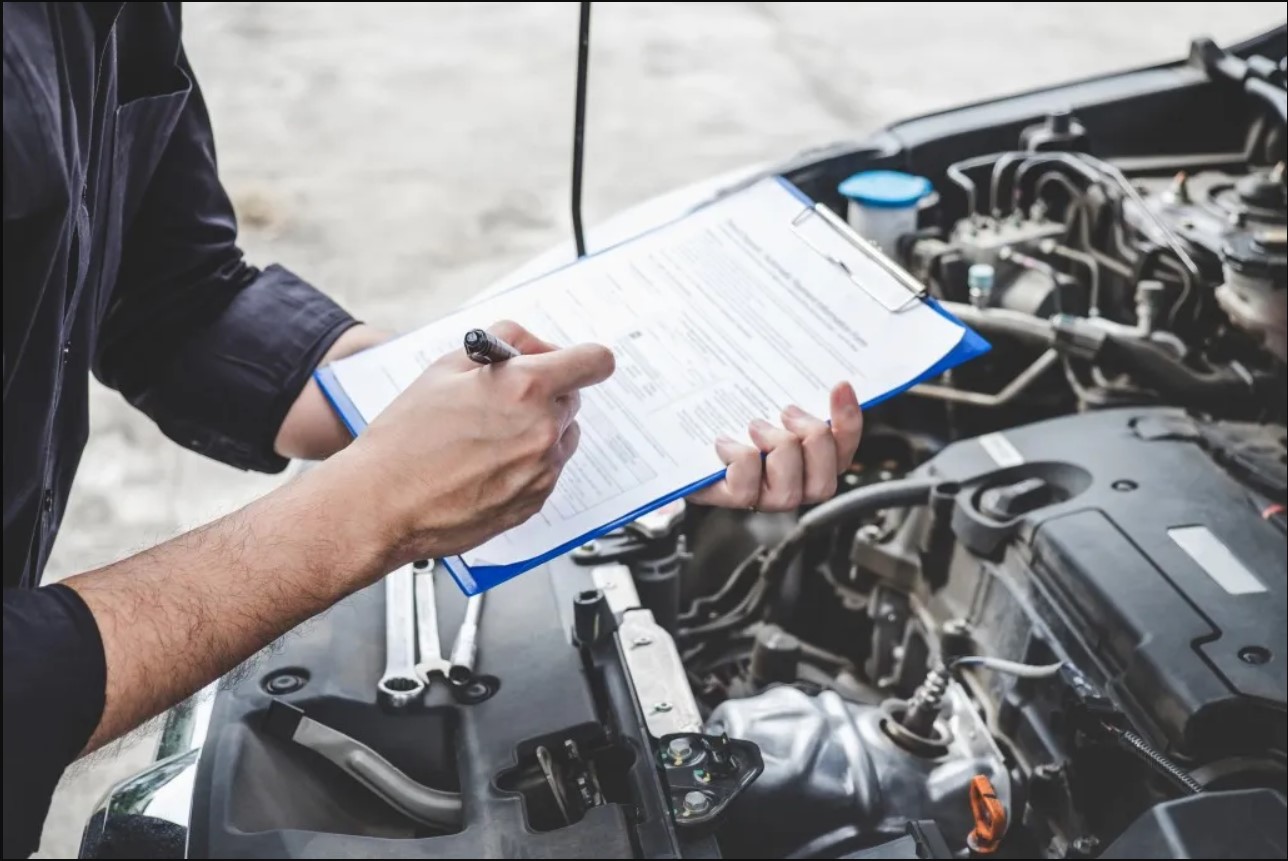 Someone Using Maintenance Log Breaking Down What is a Maintenance Log Book - OneView